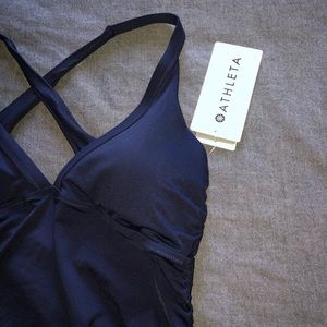 Navy blue Athleta swim top with scrunch tie sides